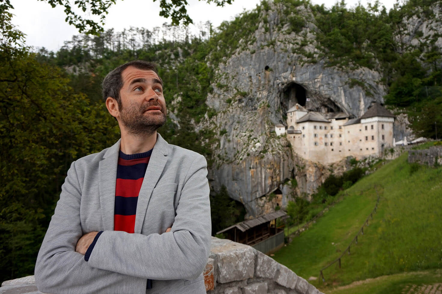 Posing in front of Predjama Castle